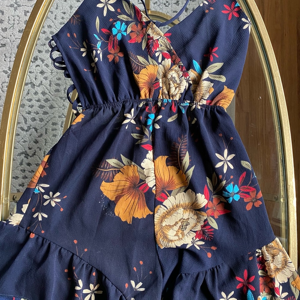 Floral Summer Romper with Ruffle bottom and Criss cross back